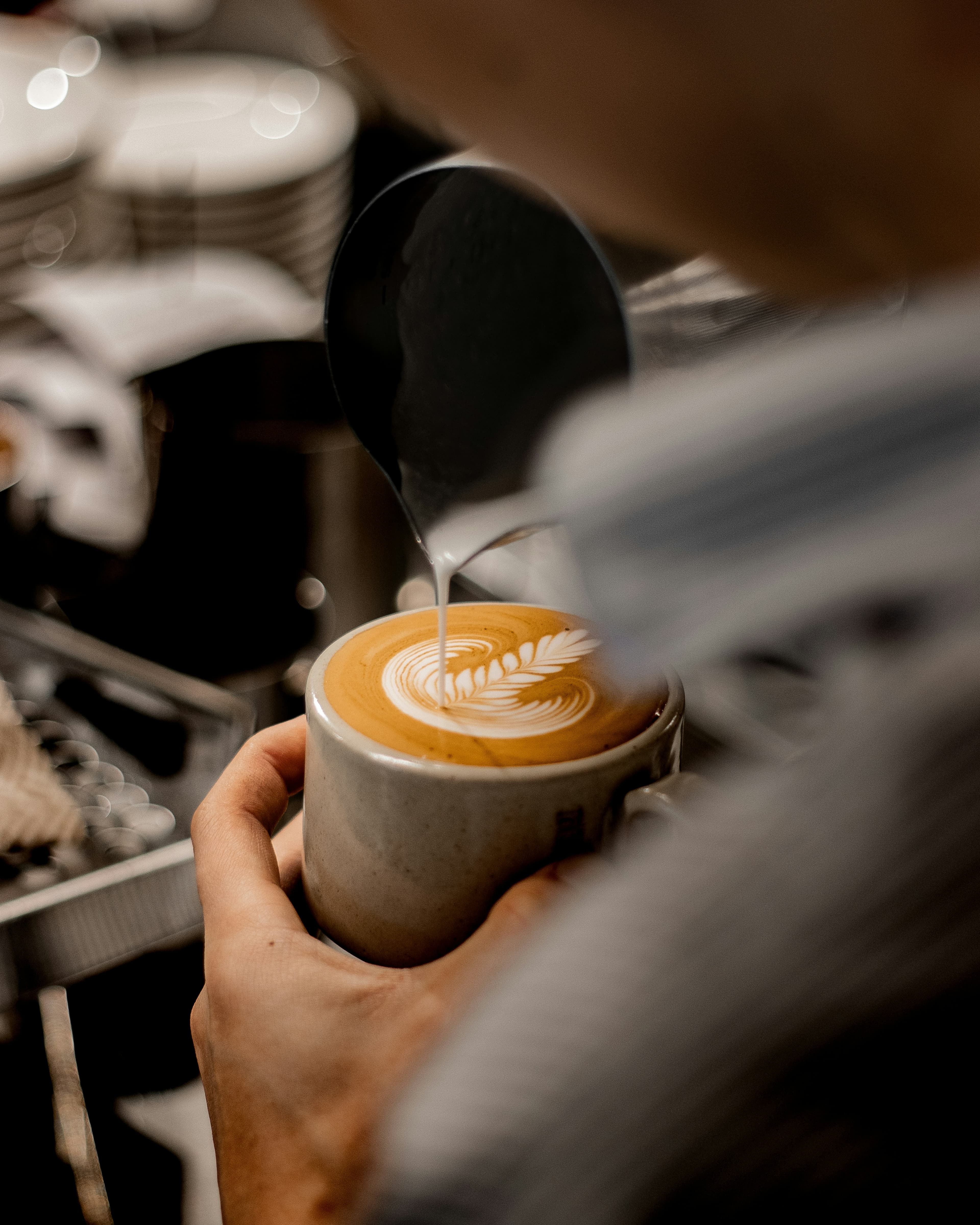 Barista pouring latte art